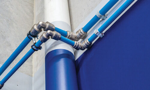 Infinity pipe and fittings expertly installed on a factory wall