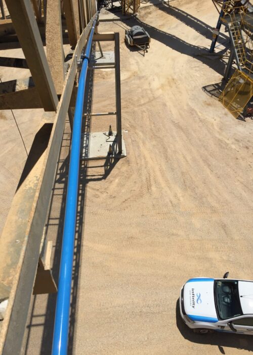 infinity compressed air pipe running along a beam in a commercial project