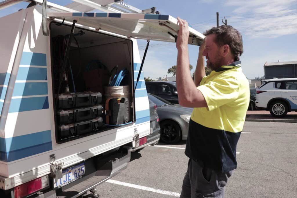 Mick opening up the back of his infinity oinstaller ute toolbox canopy