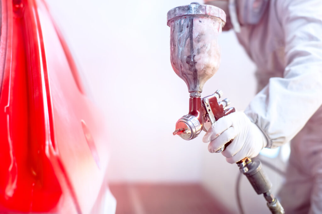 automotive paint application using compressed air powered spray gun