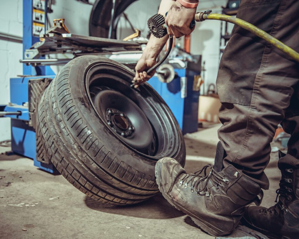 car tyre being inflated with compressed air